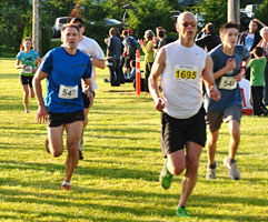 Alex and Larry sprinting past Teresa to the finish